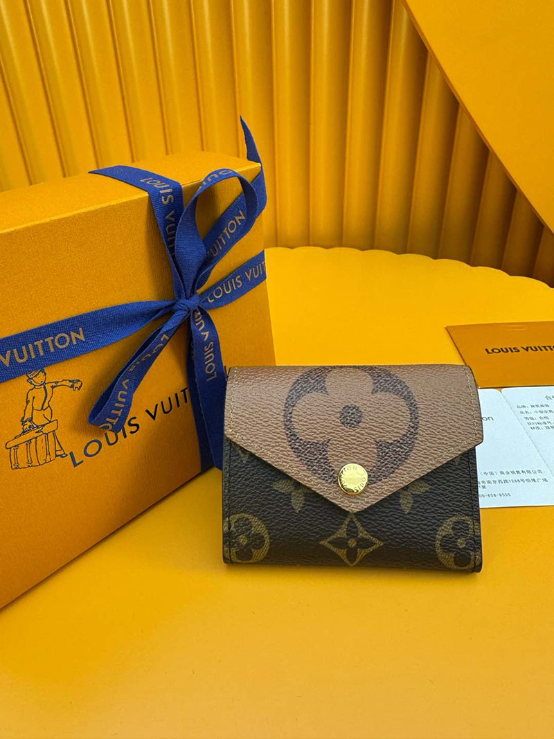 ヴィトンの財布を持つ 女